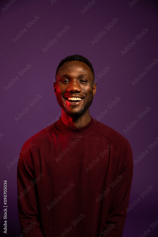 Obraz premium African Man Smiling for Camera on Isolated Background