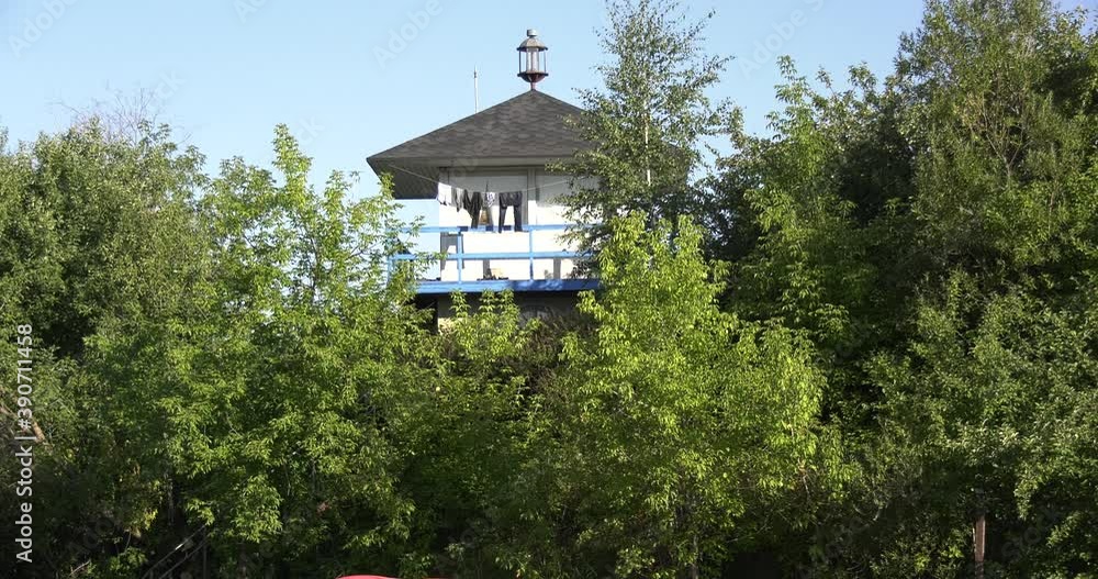 4K high quality calm windless bright summer morning video of Moscow Channel yacht club bungalow, clothes drying and planes flying in the background, green trees near Dolgoprudny town, Moscow, Russia 4K high quality calm windless bright summer morning video of Moscow Channel yacht club bungalow, clothes drying and planes flying in the background, green trees near Dolgoprudny town, Moscow, Russia