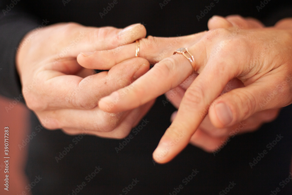 Slightly blurred wedding ring on the finger Slightly blurred wedding ring on the finger