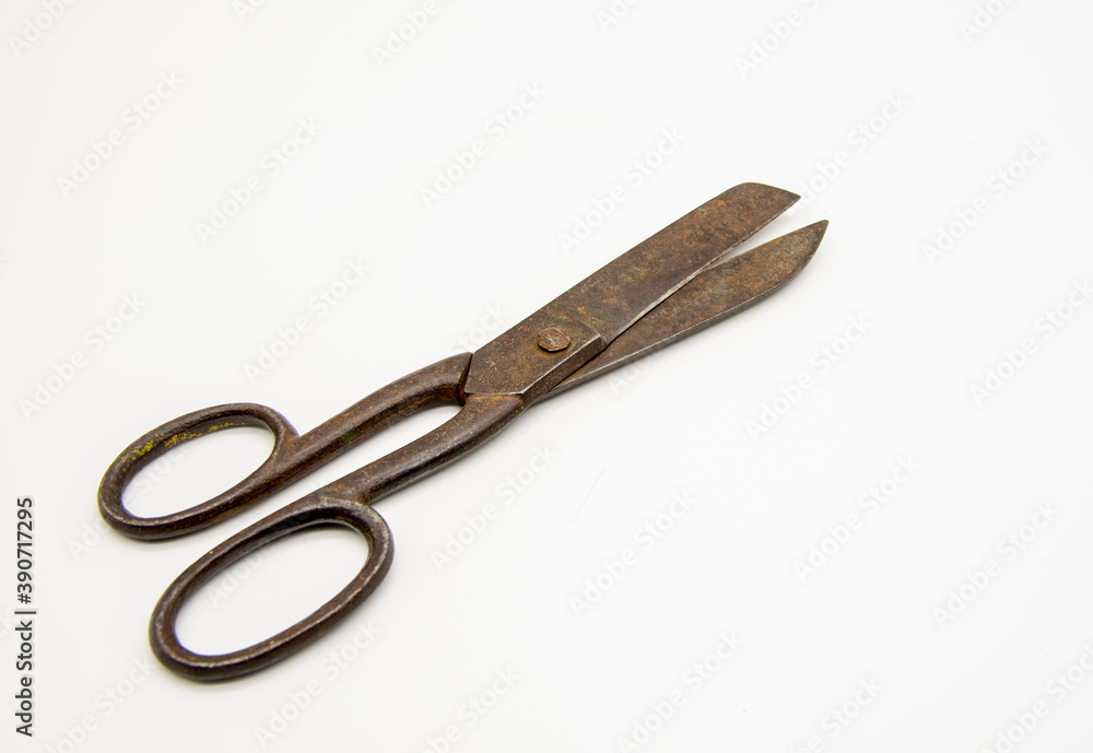 Old tailor scissors on a white background. Old tailor scissors on a white background.