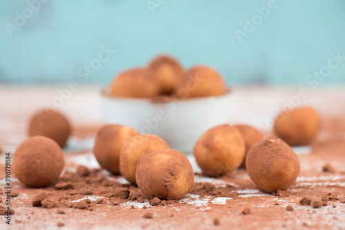 Marzipan potatoes, in german called Marzipankartoffeln, with cacao powder, sweets for christmas, empty copy space photo