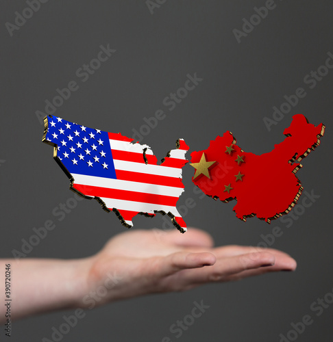 usa and china maps in hand