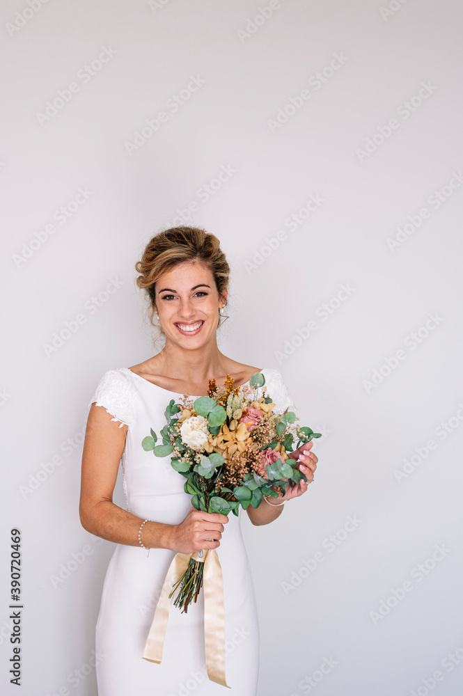 Bride to be married with bouquet of flowers