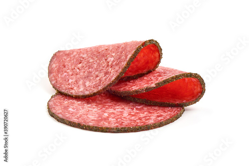 Sliced Salami with spices, isolated on white background