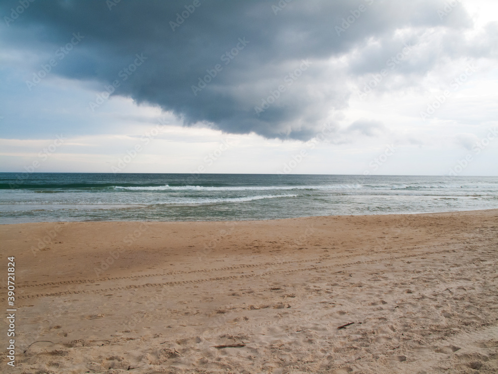 beach with rain clouds