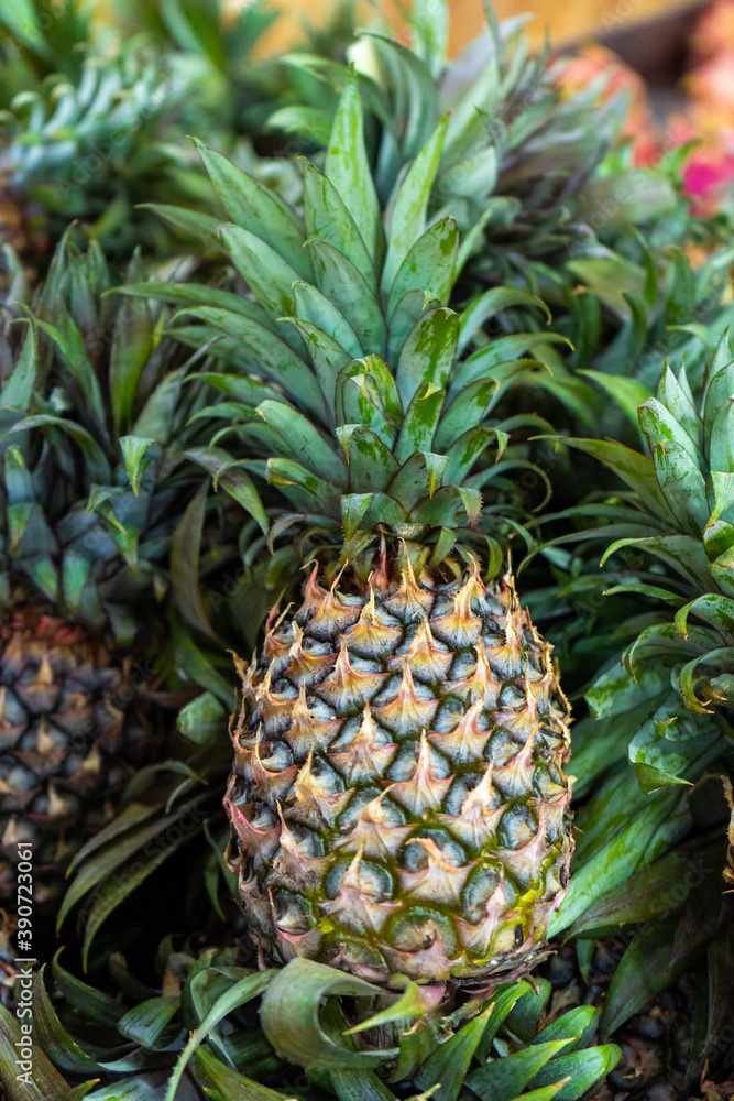 Freshly cut pineapples on the counter of a street food market Freshly cut pineapples on the counter of a street food market
