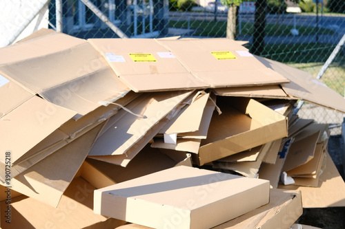 there are many cardboard boxes lying on the ground, concept of mailing, package, shopping online, waste paper, renewable product, recycling photo