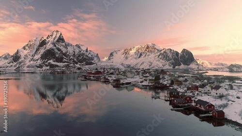 Aerial footage and timelapse over fisherman village in winter time , fjords in Lofoten archipelago in northern Norway 