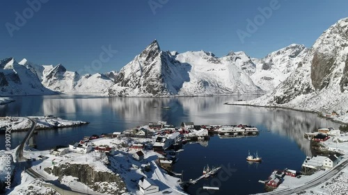 Aerial footage and timelapse over fisherman village in winter time , fjords in Lofoten archipelago in northern Norway
