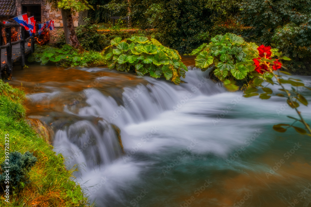 Waterfall on Korana river canyon in village of Rastoke. Slunj in Croatia. Near Plitvice Lakes National Park. August 2020, long exposure picture. Waterfall on Korana river canyon in village of Rastoke. Slunj in Croatia. Near Plitvice Lakes National Park. August 2020, long exposure picture.