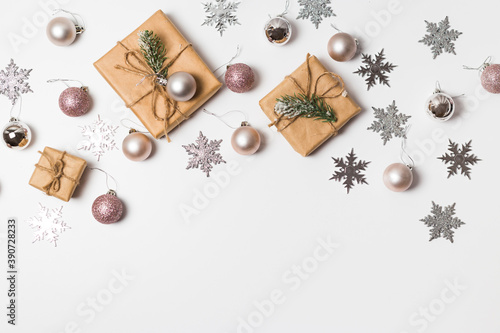 Christmas greeting card. Gift boxes and Christmas decorations layout on an isolated white background, top view. Flat lay