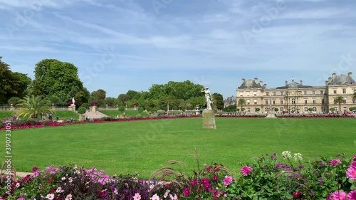 Footage of people walking and relaxing at famous garden called 