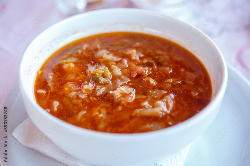 A Cup of borscht made from potatoes, vegetables and meat. Close up A Cup of borscht made from potatoes, vegetables and meat. Close up