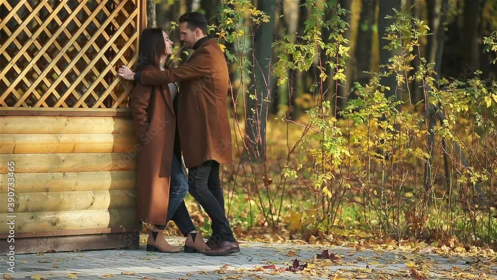 Happy family walking in autumn park on sunny fall day Happy family walking in autumn park on sunny fall day