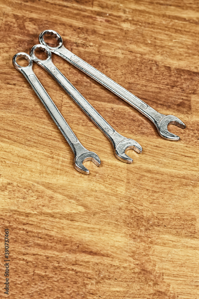 tool iron wrench set different size lies on a wooden background tool iron wrench set different size lies on a wooden background