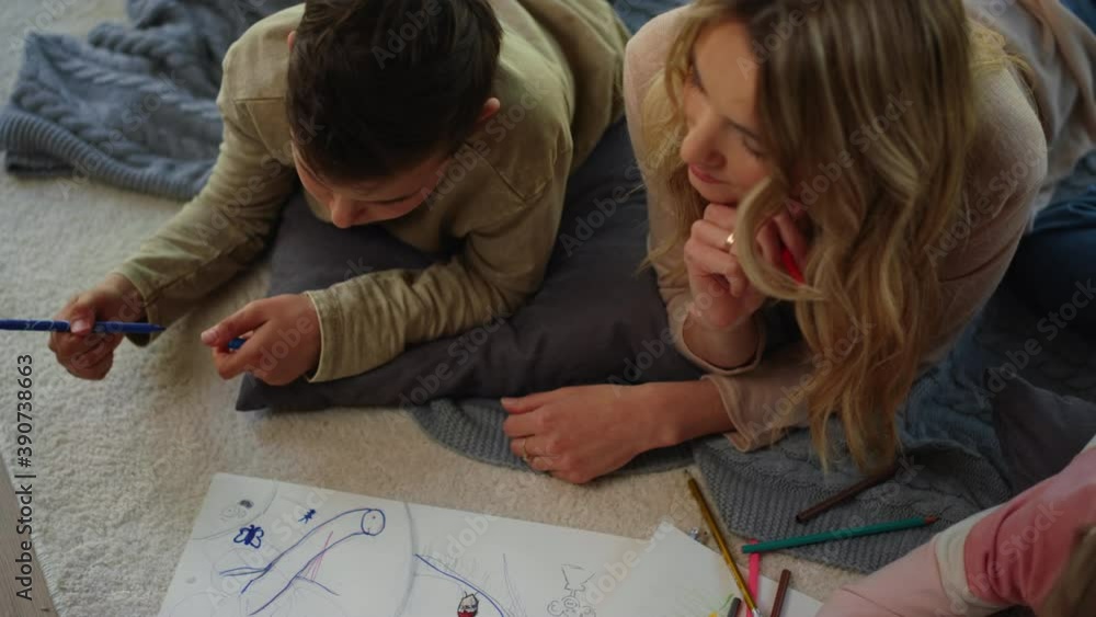 Mom observing creative siblings. Mother advising children how draw picture. Mom observing creative siblings. Mother advising children how draw picture.