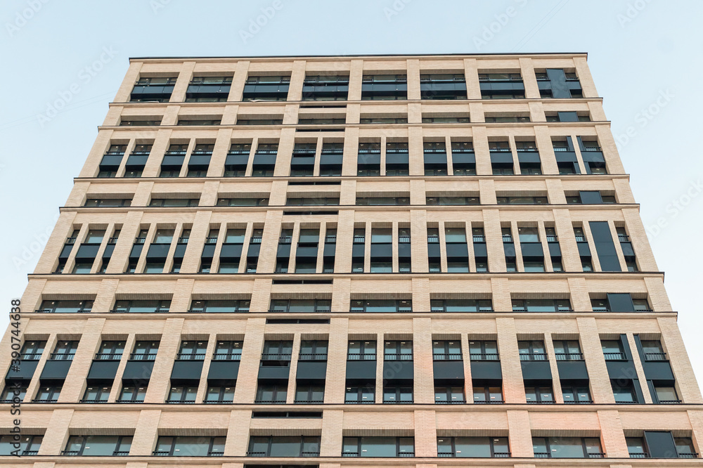 large office building tall against the sky closeup city architecture background