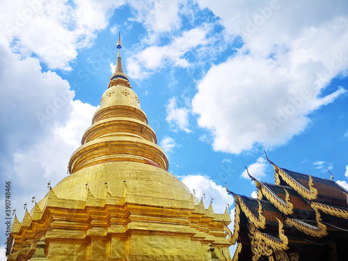 Low angle shot of the Wat Phra That Hariphunchai Buddhist temple in Lamphun, Thailand photo