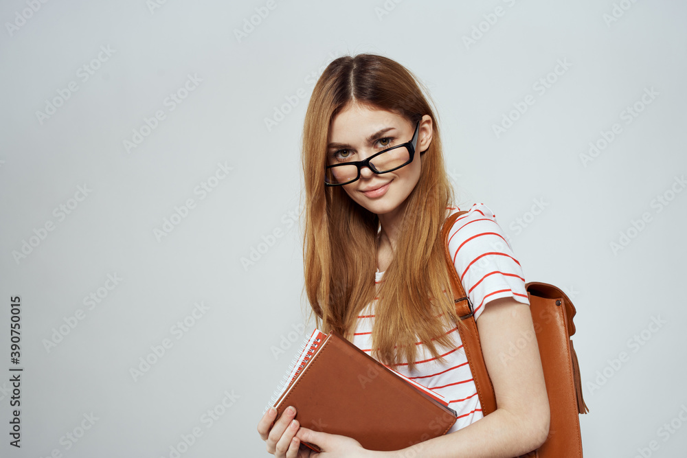 female student with notepad and backpack on back cropped view education science glasses female student with notepad and backpack on back cropped view education science glasses