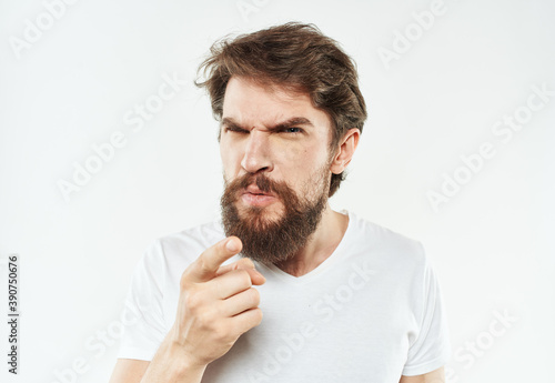 Man with beard in white t-shirt cropped view of emotion model