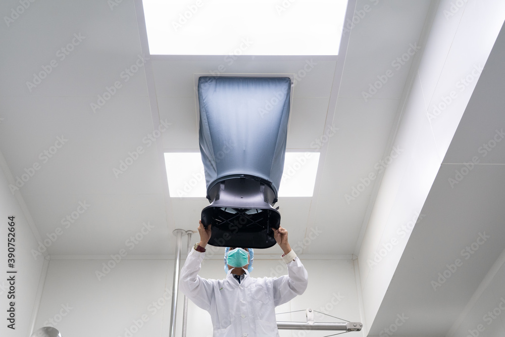 Unidentified operator is using the capture hood balometer to measuring ...