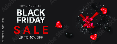 Silver black friday lettering with black gift box among black and red heart on the dark background poster for promotion.