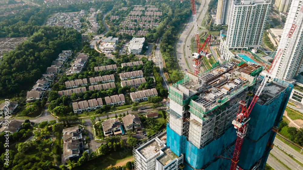 Aerial  view of High rise residential development. Image shows Construction worker with safety attire