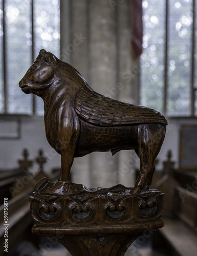 SWAFFHAM, UNITED KINGDOM - Aug 06, 2019: A beautiful and intricate bull wood carving photo