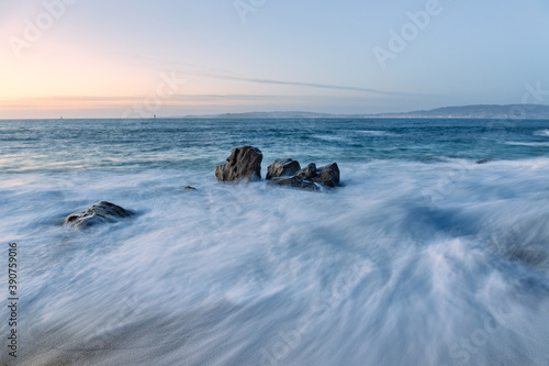 Mesmerizing shot of sunset at Tulla beach, in Bueu, Galicia, Spain photo