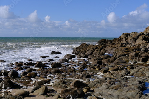The rocks and the foam of the Atlantic ocean at Batz-sur-mer.