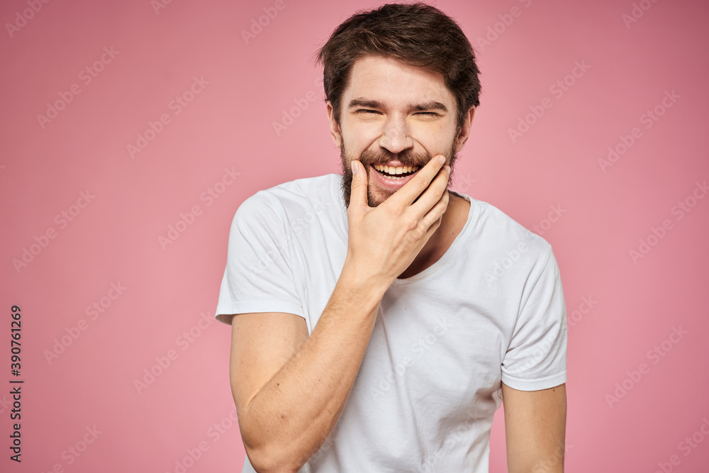 man in white t-shirt gesturing with his hands emotions fun pink background man in white t-shirt gesturing with his hands emotions fun pink background