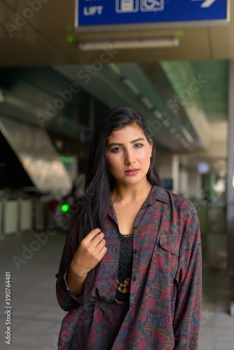 Portrait of beautiful young woman ready to travel vertical shot