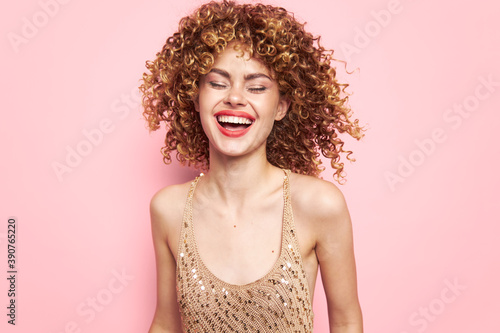 Attractive woman Dress with sequins party laugh bright makeup pink background