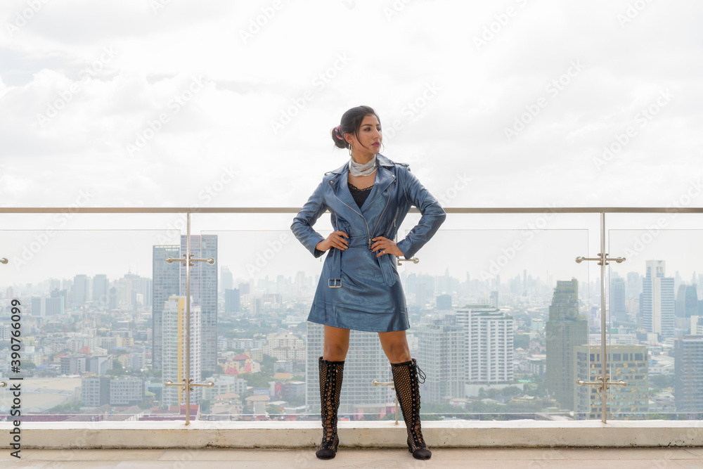 Portrait of beautiful young woman outdoors at rooftop Portrait of beautiful young woman outdoors at rooftop