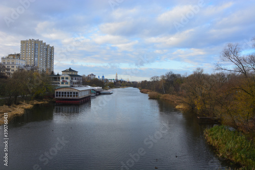 Autumn landscape . The photo was taken on the bridge over the river .