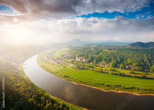 Fantastic foggy image of valley Elbe river. Location place Saxon Switzerland national park, Germany. photo