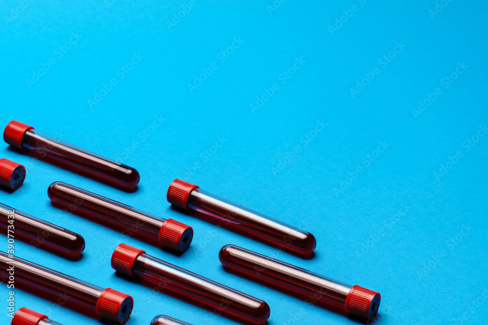 top view of medicine test tubes with blood samples over blue background top view of medicine test tubes with blood samples over blue background