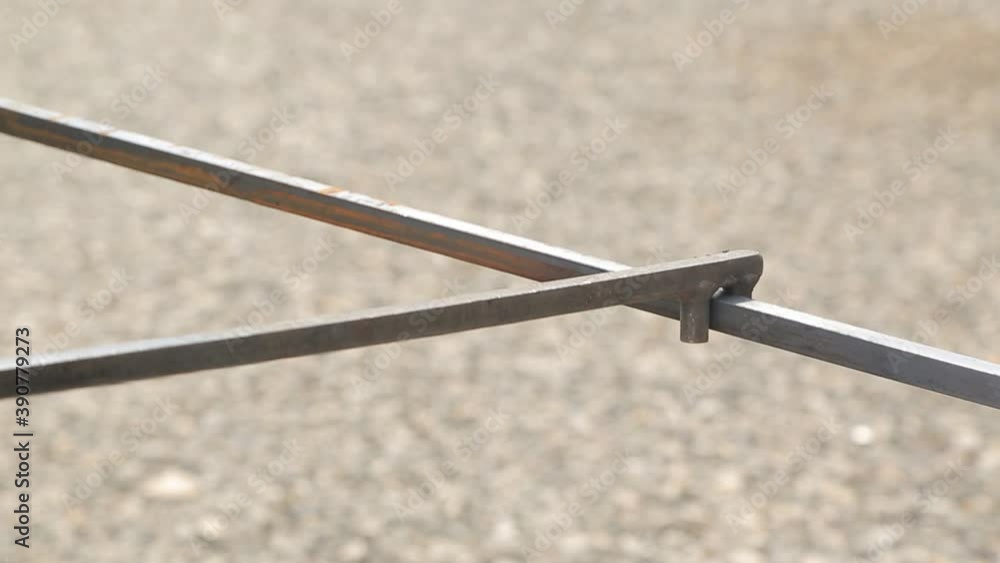 a hand forged blacksmith rolls a hot metal plate / profile. artistic hand forging a hand forged blacksmith rolls a hot metal plate / profile. artistic hand forging