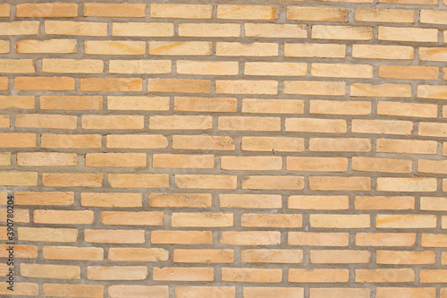 Clay brick wall with a reddish hue