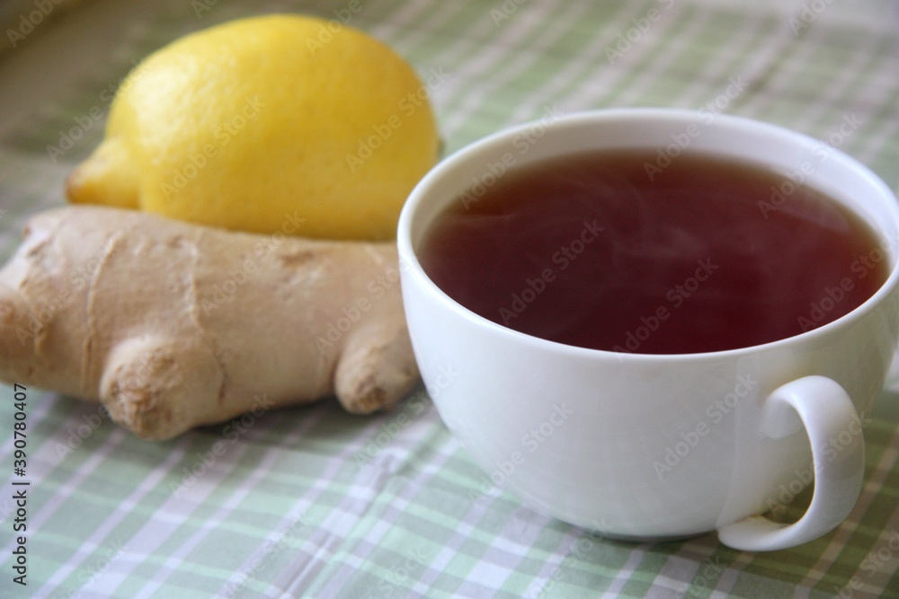 Black hot tea with fresh and natural lemon and ginger root is good for treating colds and viral diseases. Black hot tea with fresh and natural lemon and ginger root is good for treating colds and viral diseases.