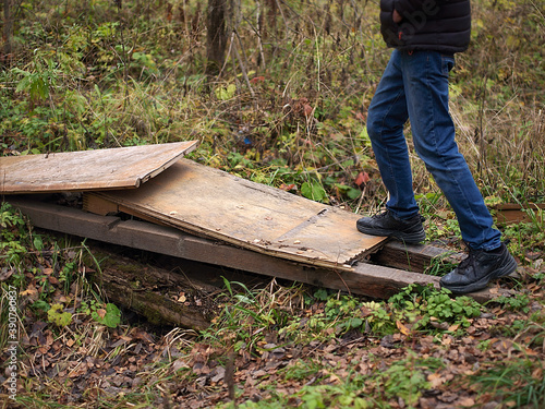 Man crossing a ditch