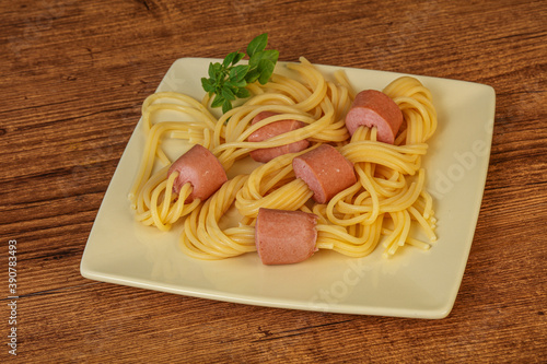 Kids pasta spaghetti with sausages