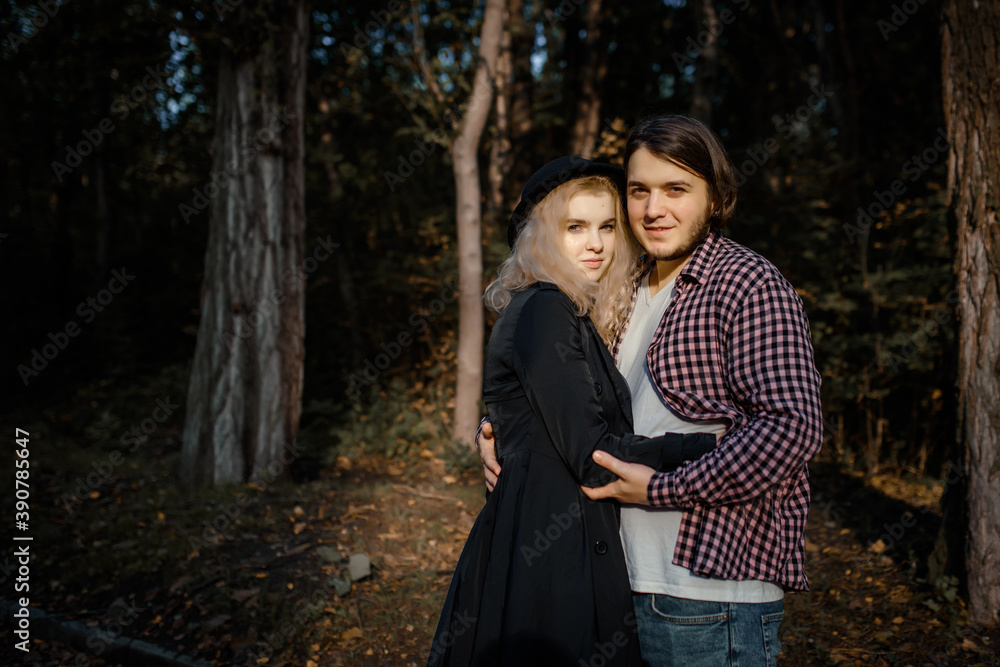 Young couple are hugging and loving each other in autumn park Young couple are hugging and loving each other in autumn park