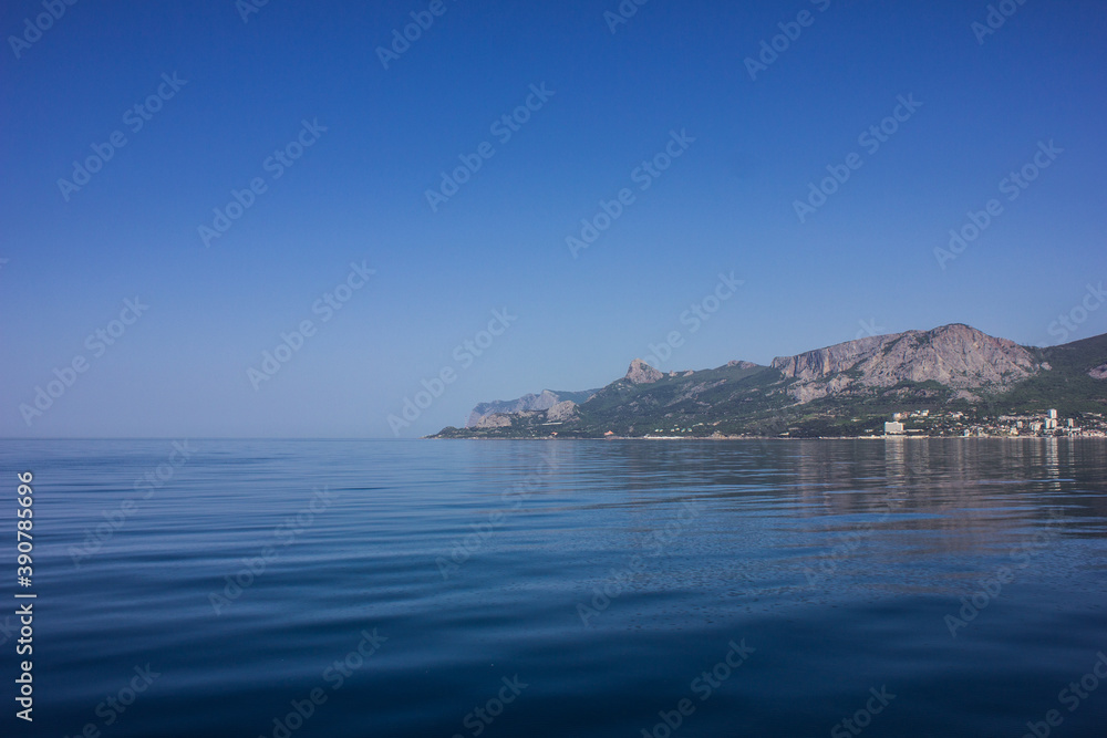 Republic of Crimea, Balaklava city Sea in the morning and mountains illuminated by the sun. Black Sea.