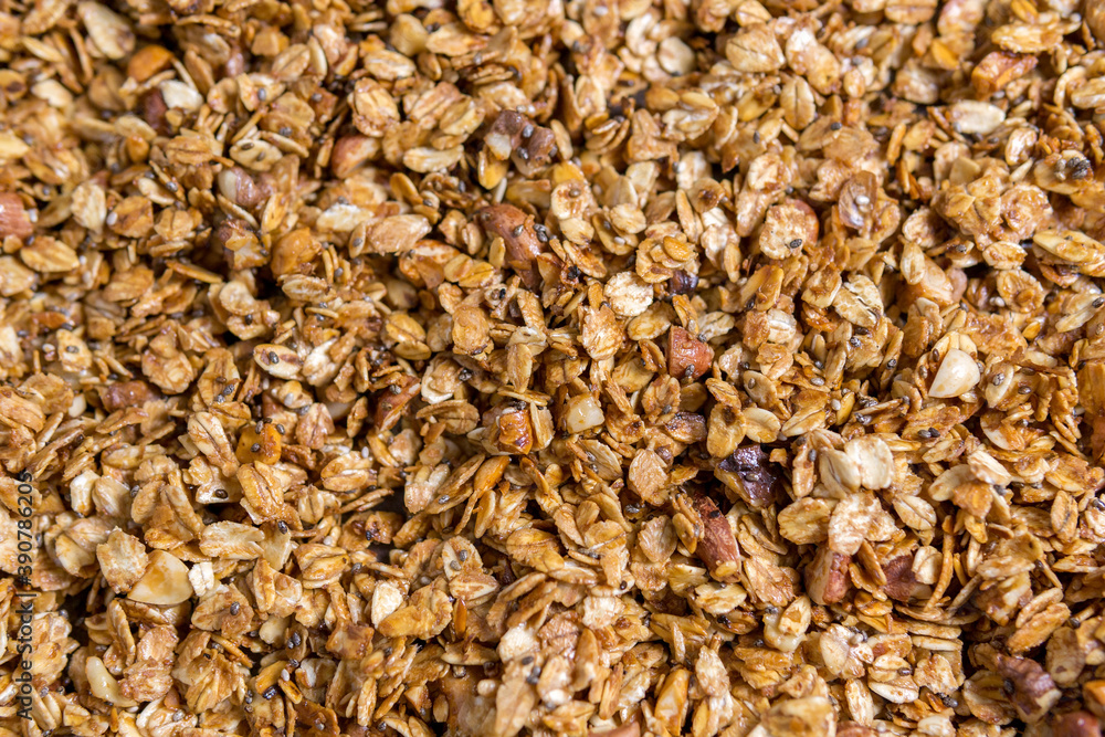 Texture oatmeal granola or muesli as background. Food concept. Healthy and wholesome food. Texture oatmeal granola or muesli as background. Food concept. Healthy and wholesome food.
