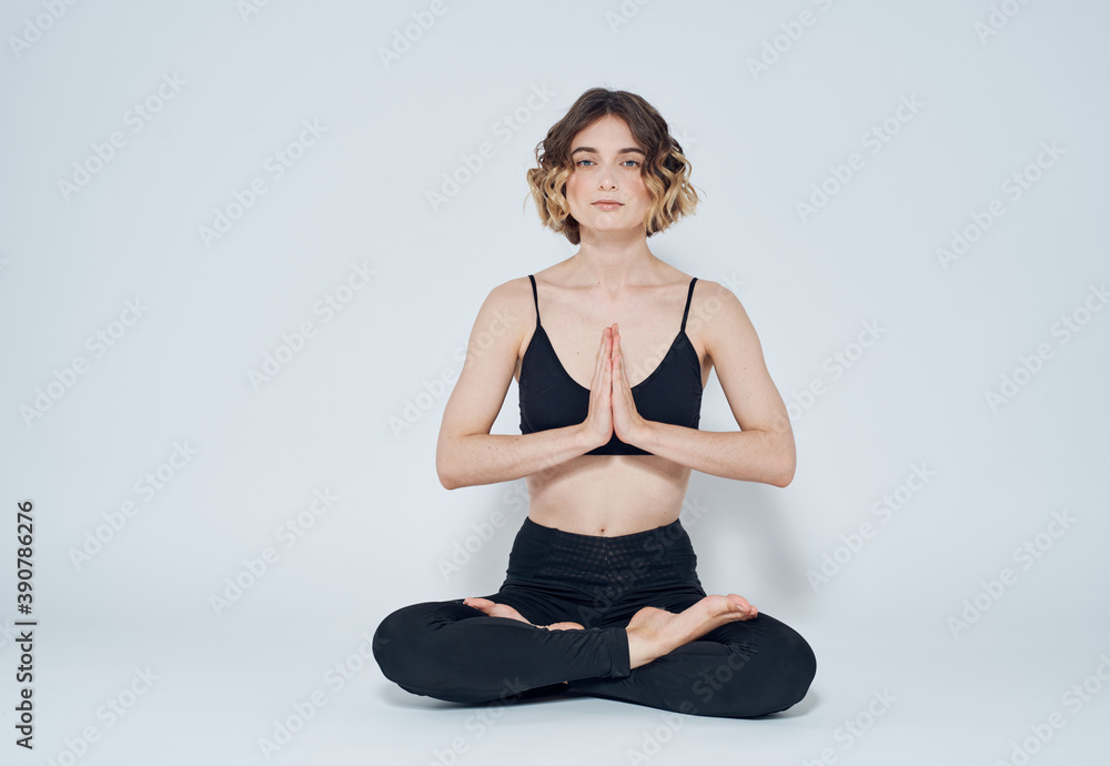 Woman meet legs sitting on the floor meditation yoga asana