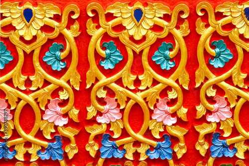 Beautiful gold Thai traditional style in temple Thailand on red background