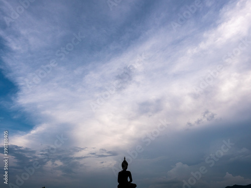 silhouette of a person in the sky and clouds