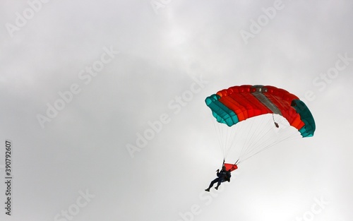 A gliding parachutist in a cloudy weather.