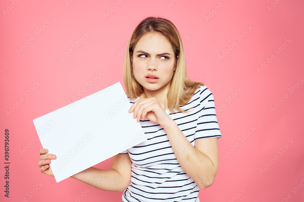 woman holding white sheet in her hands striped t-shirt emotions pink background woman holding white sheet in her hands striped t-shirt emotions pink background
